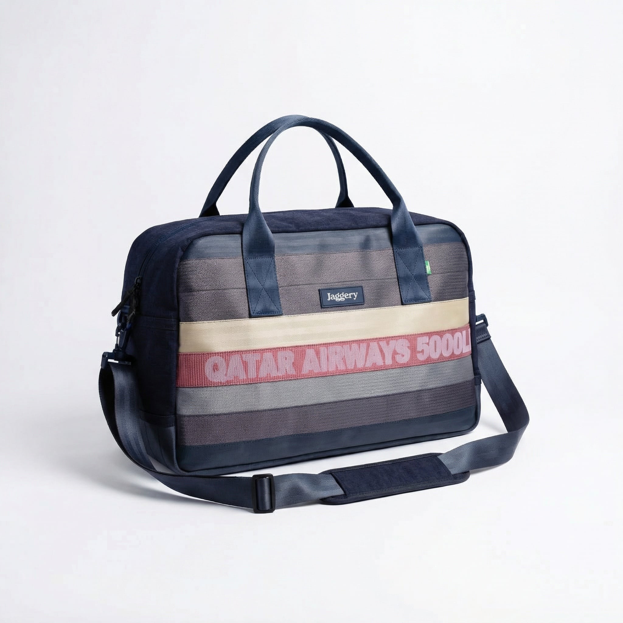 Jaggery Upcycled Weekender Bag A large weekender bag made with upcycled cargo belts of different colors