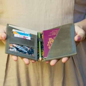 Woman holding open passport holder.jpg