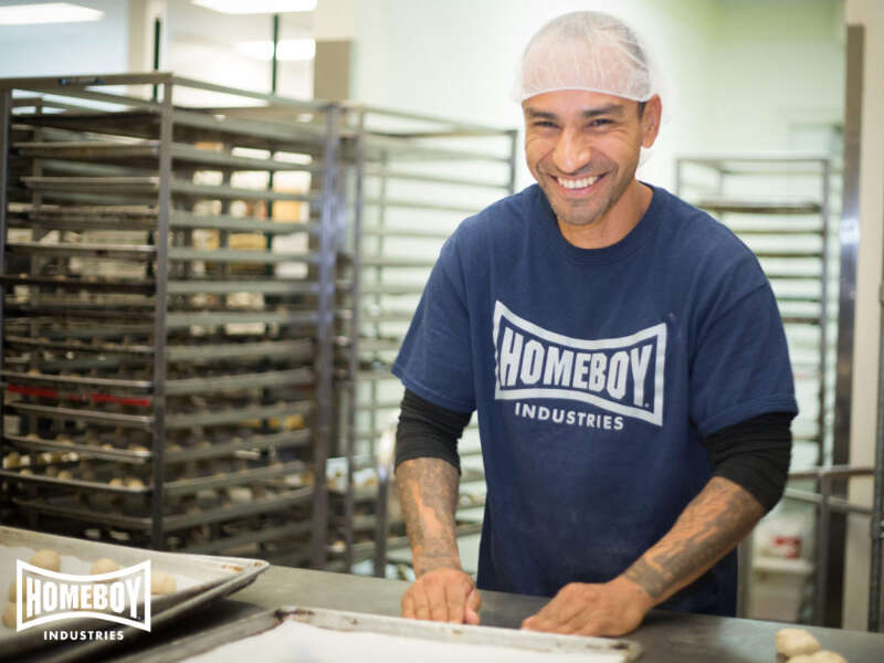 Your edible corporate gifts can make a difference in the lives of the formerly incarcerated, like a worker from Homeboy Industries pictured here.