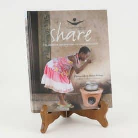 SHARE cookbook on a small cookbook stand