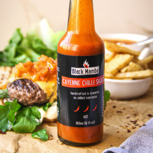 You can choose the flavor of chilli sauce in your condiment gift. Cayenne is shown here with steak frites in the background.