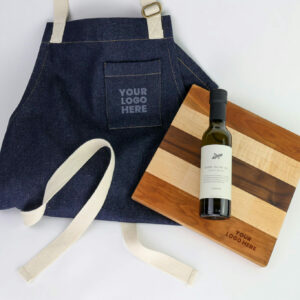 Our apron gift box includes a denim apron, customizable grazing board, and olive oil.