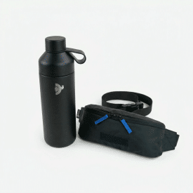 a black water bottle stands next to a black fanny pack with two blue zipper handles