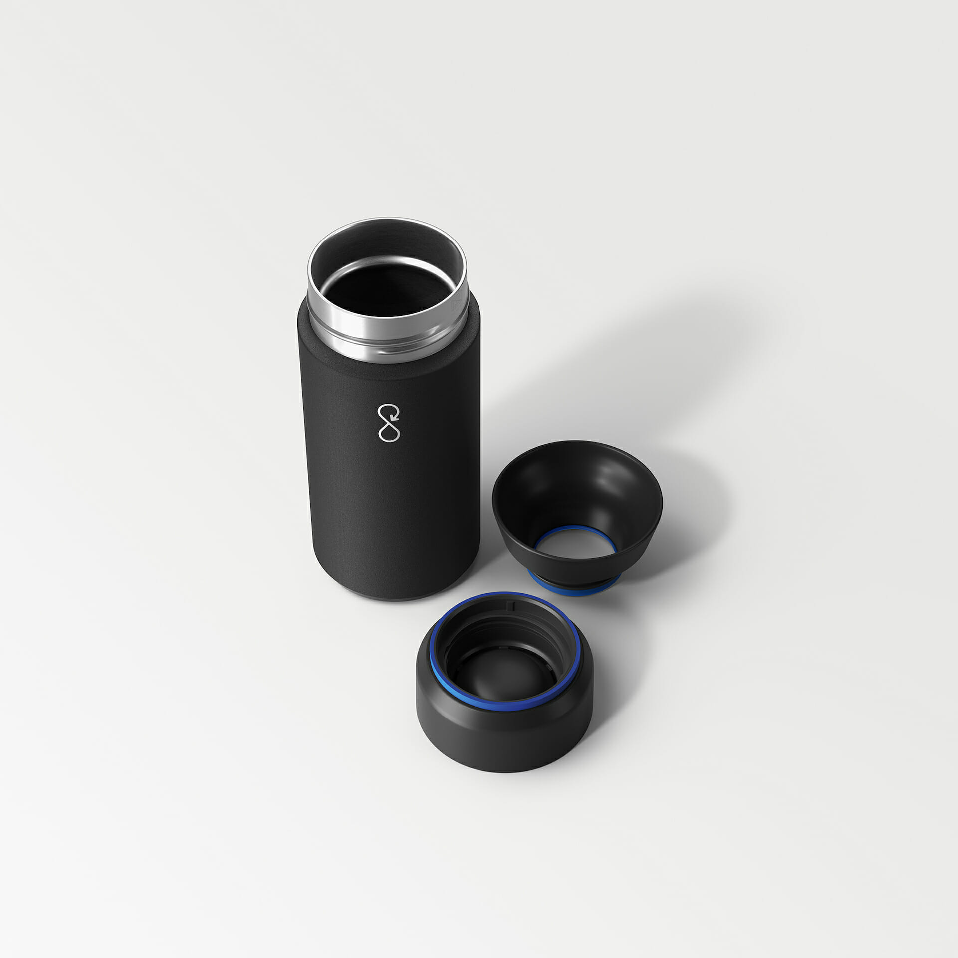 One of the personalized stainless steel travel mugs disassembled into three parts One of the personalized stainless steel travel mugs disassembled into three parts