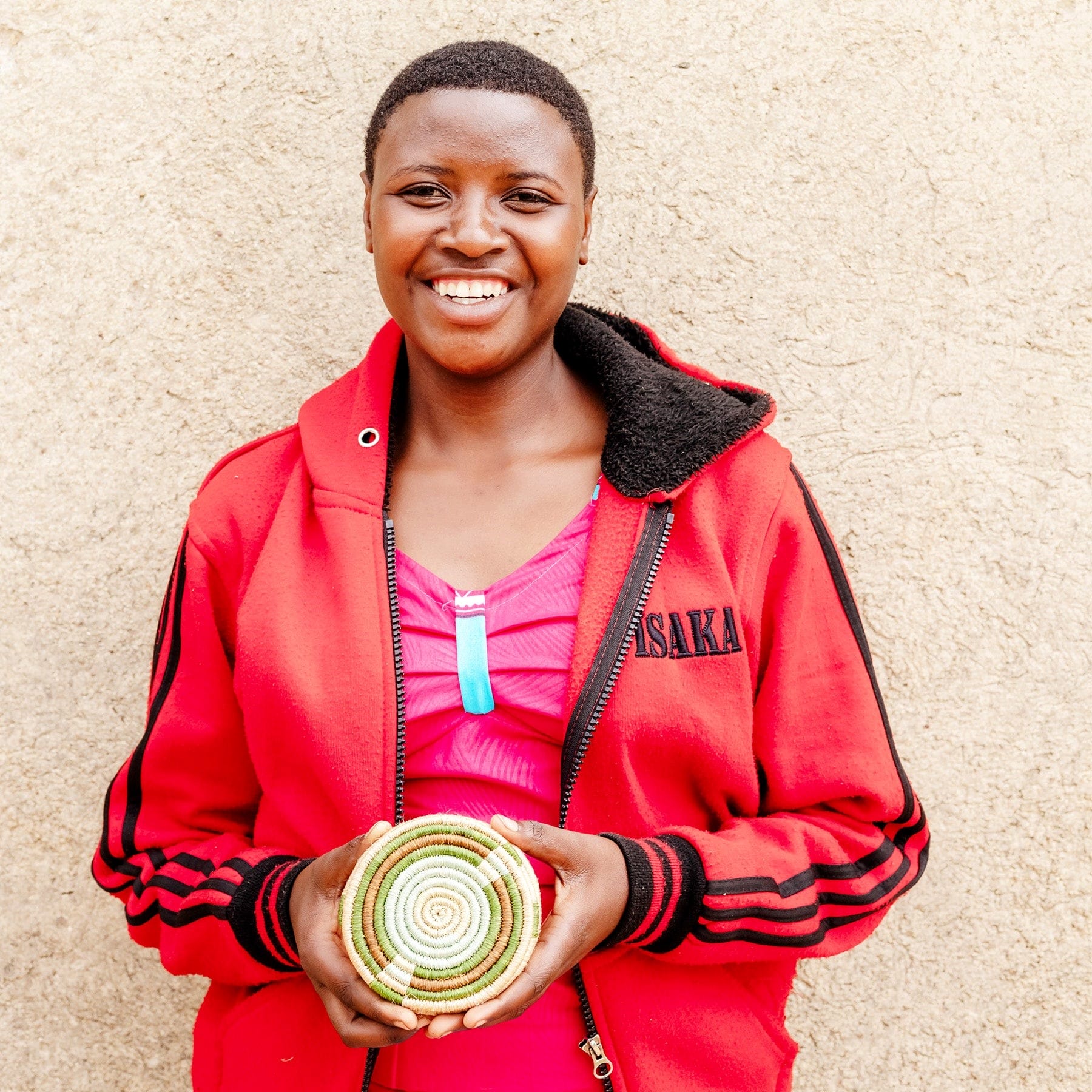 Artisan holding green coaster Artisan holding green coaster