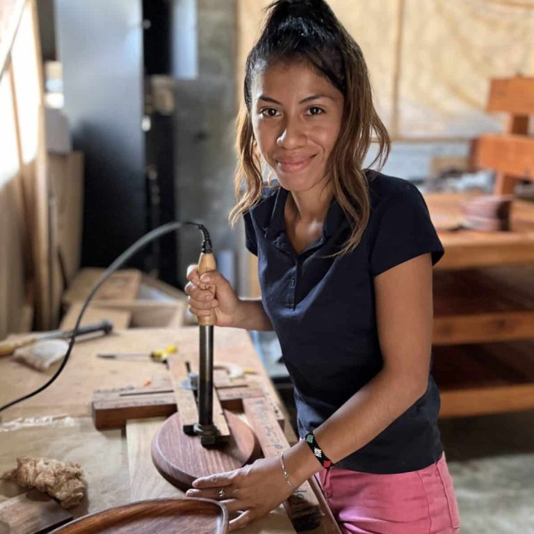 woman making corporate gifts from sustainably harvested wood