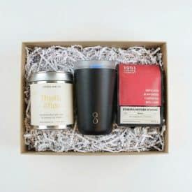 Fill Your Cup Gift Box white background A gift box with tea, coffee, and a tumbler nextled in white crinkle paper. A unique corporate gift.