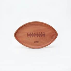 football tray a wooden tray shaped like a football with engraved laces and 49ers Foundation logo