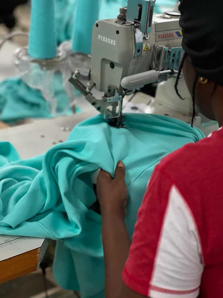 hands making t-shirts for corporate gifts