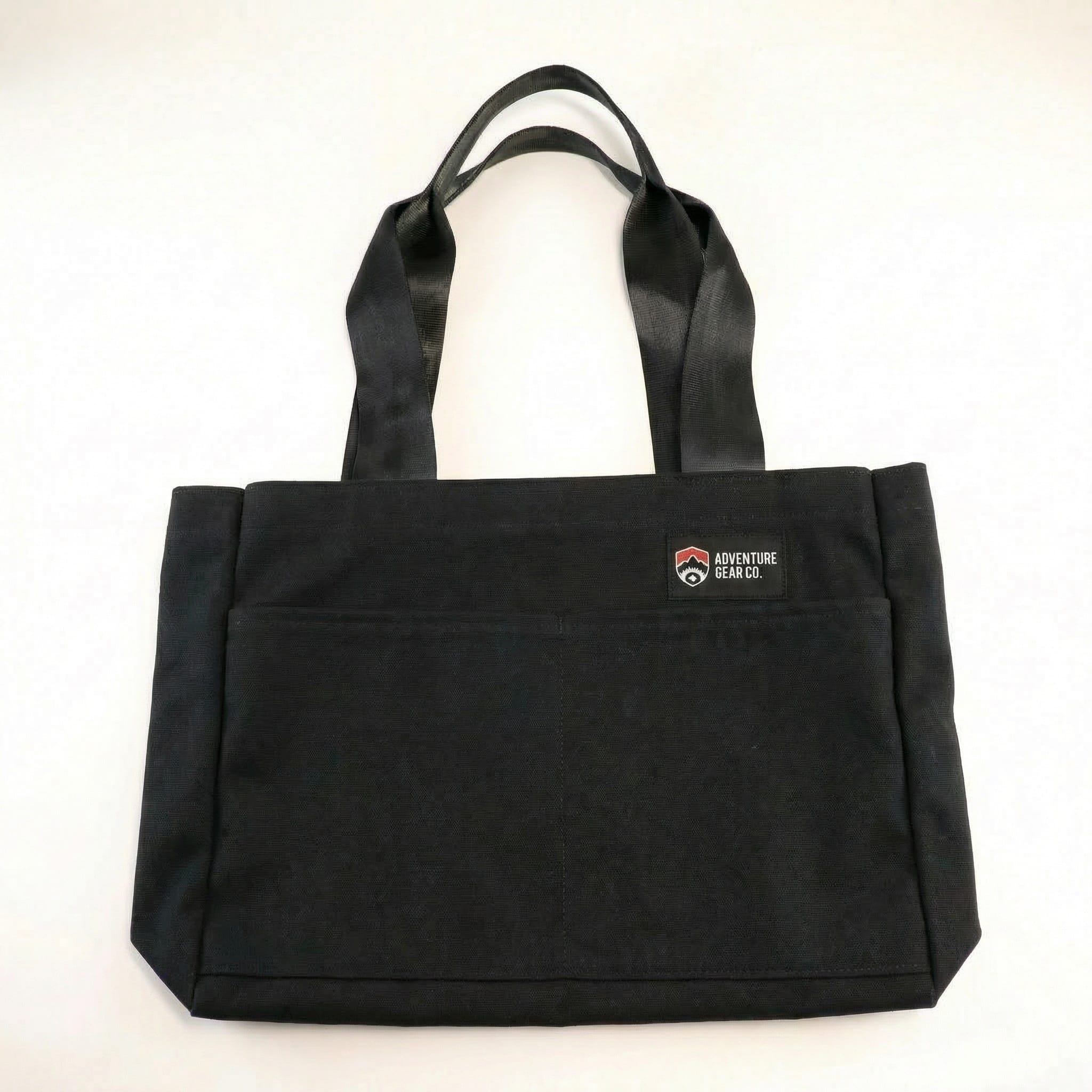 jaggery sidekick tote in black a black brandable tote back with black handles made from upcycled seat belts