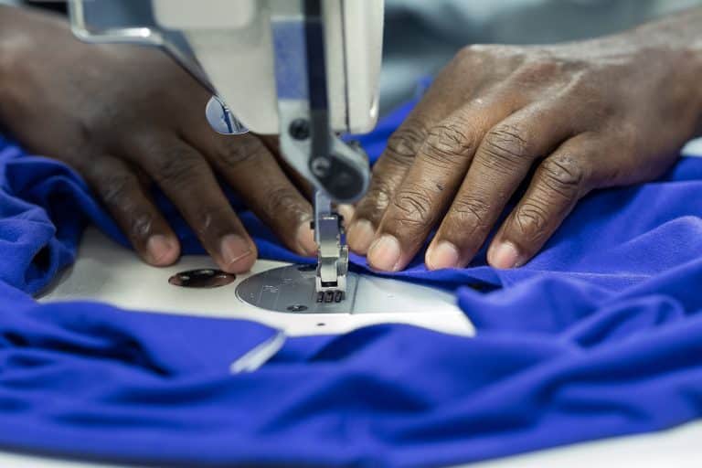 hands making t-shirts for corporate gifts