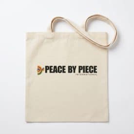 mi eelo tikal tote a simple event tote with a logo that says peace by piece international