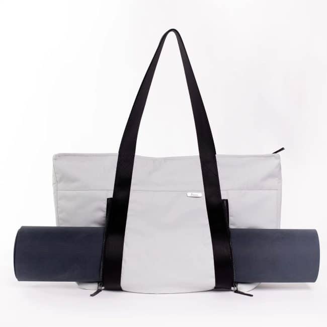 an athletic tote with a unique pocket that fits a yoga mat - a great executive gift idea