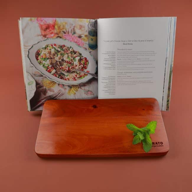 Corporate gifts for the holidays with a charcuterie board and cookbook that make a positive impact