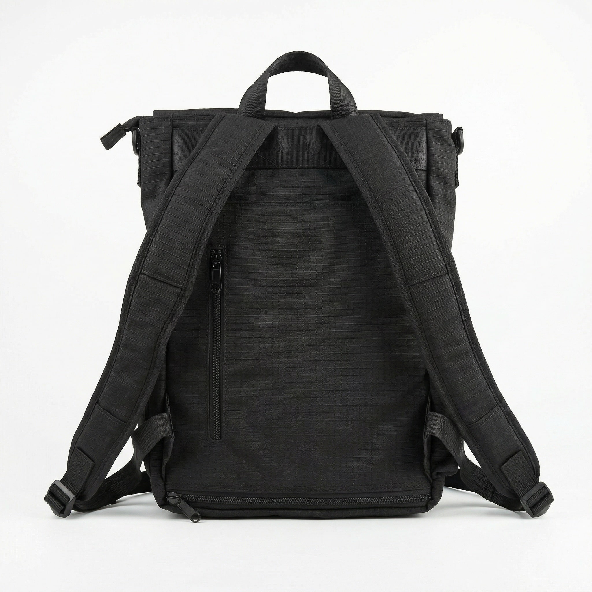 NoBoundaries Travel Edition Back View a back view of a black backpack with a "hidden" security zipper pocket and optional zippered "sleeve" for attaching it to a roller bag
