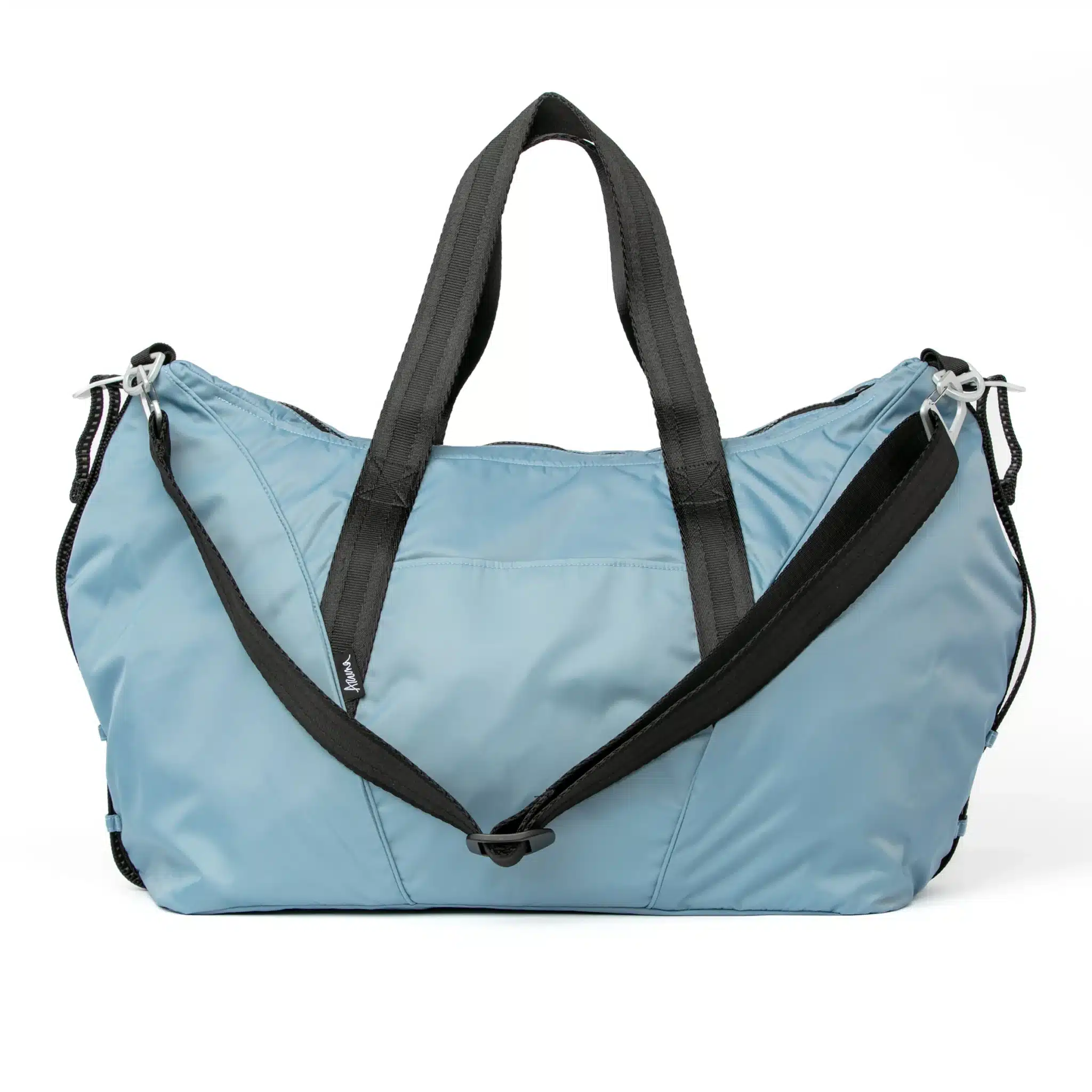 aruna duffel blue front A light blue duffel bag made by women survivors of trafficking