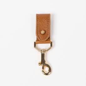 brown sustainably-sourced leather key chain with gold hardware