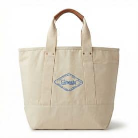 a cream colored tote back with leather handsl and a corporate logo