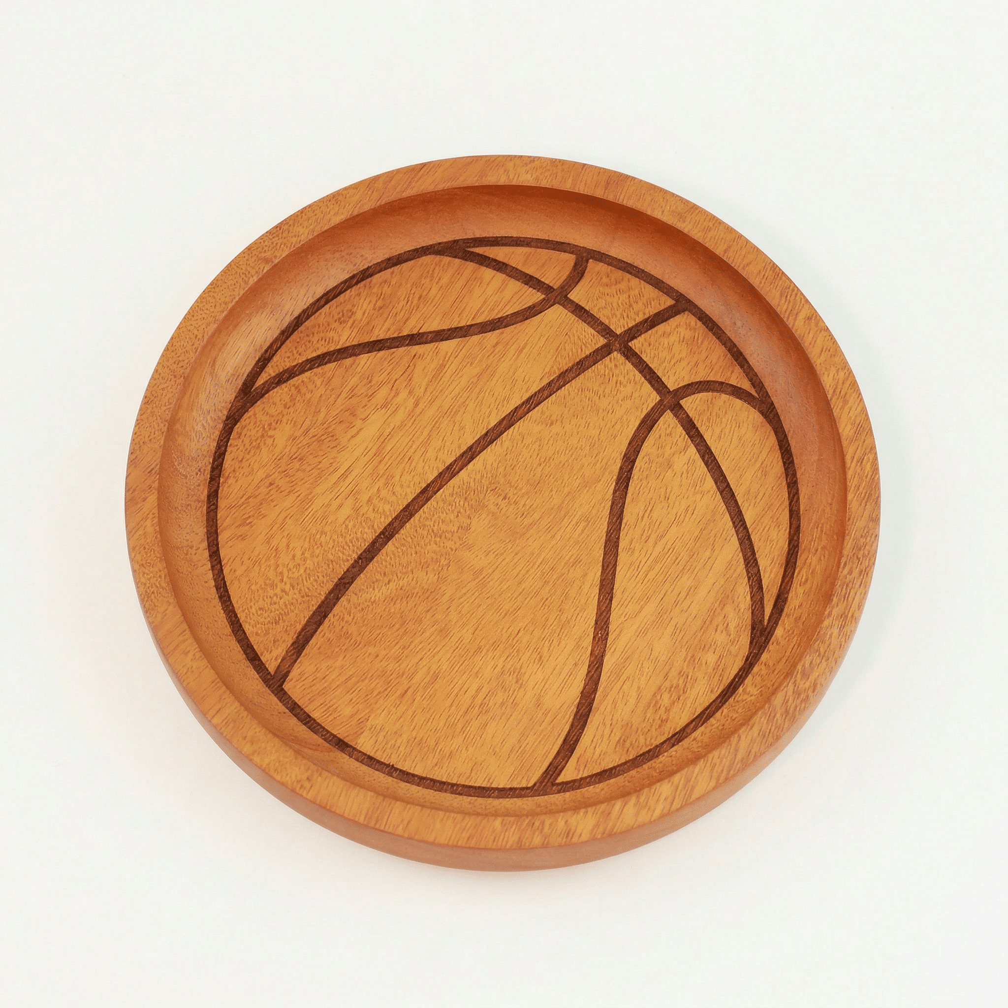 Itza Wood basketball tray plain a wooden tray with an engraving to make it look like a basketball.