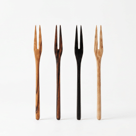 Four handcrafted wooden picks in a variety of wood types stand against a white background
